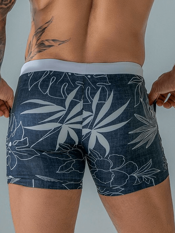 Alt Tag: Stylish quick dry men's swim shorts with floral print, back view.